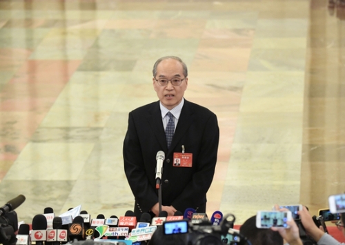 3月12日，十二届全国人大五次会议在北京人民大会堂举行第三次全体会议。这是司法部部长张军接受采访。新华社记者 赵颖全摄