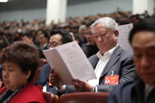 3月12日，十二届全国人大五次会议在北京人民大会堂举行第三次全体会议。这是全国政协委员列席会议。新华社记者 金立旺摄。