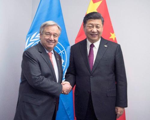 ——会见联合国秘书长古特雷斯，表明中国坚持多边主义、支持联合国发挥更大作用的坚定态度。