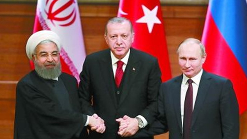 土耳其总统埃尔多安（中）、俄罗斯总统普京（右）和伊朗总统鲁哈尼
