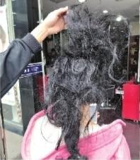 女子蓄16年的1.4米长发洗后打结 向美发店索赔5万