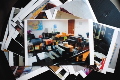房云云在安徽省银监局副局长胡沅的家中行窃时拍摄到600多张购物卡还有大量名贵香烟、酒的照片。资料图片/视觉中国